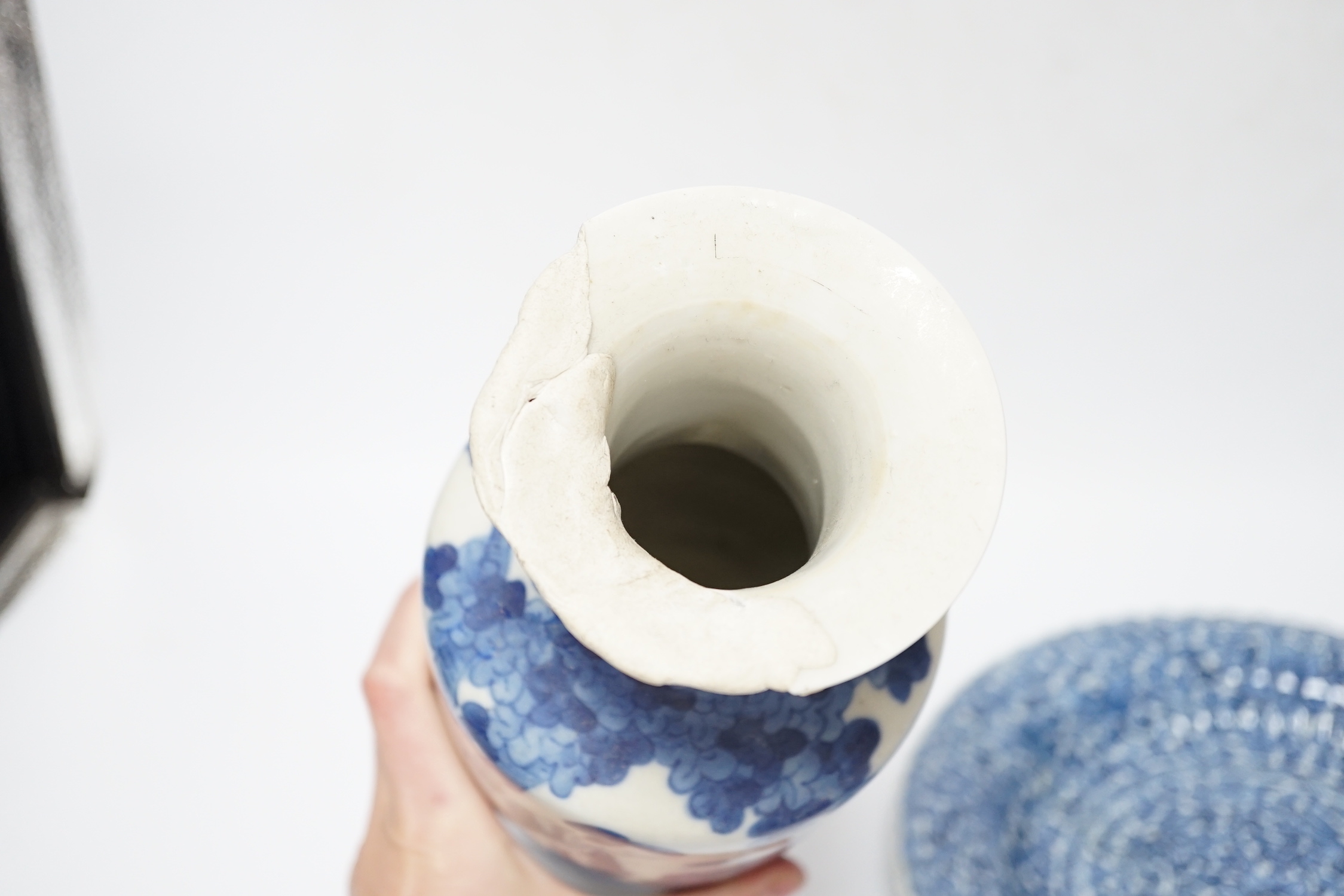 A group of Chinese blue and white dishes and plates and a damaged vase, 30cm